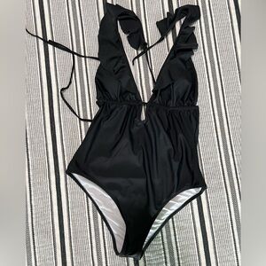 Black CUPSHE one piece with ruffles. Size XL. Used/like new. Only worn once.